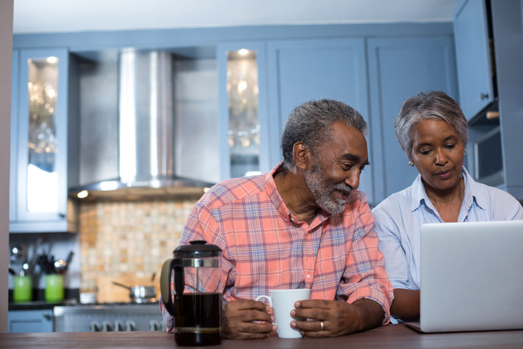 Couple looking at laptop Insurance For 60 Years Old 2 Scaled